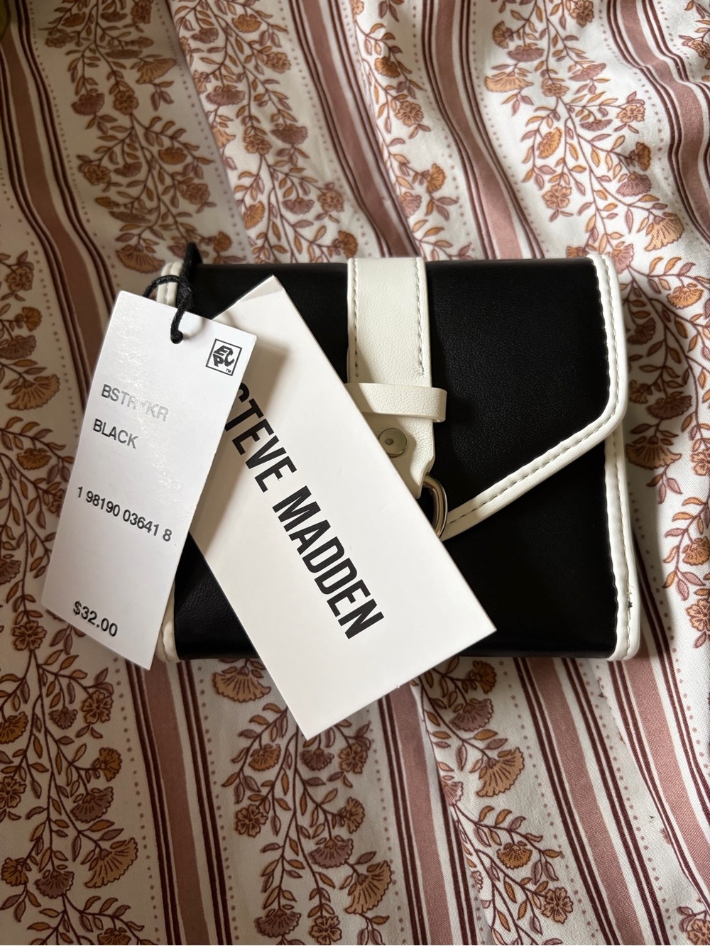 Steve Madden black wallet with buckle detail